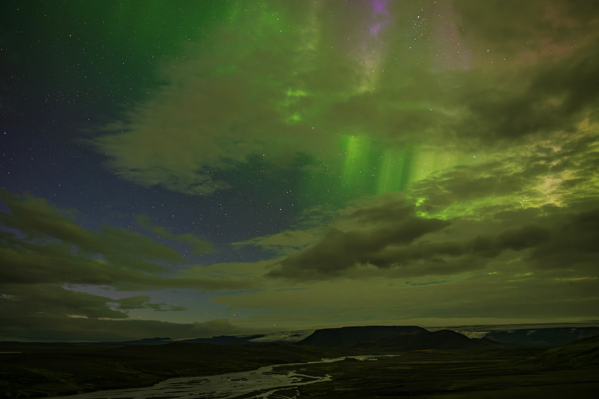 Bright aurora borealis above Icelandic River