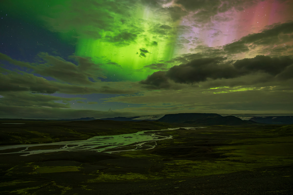 Bright aurora borealis above Icelandic River